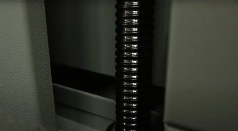 Creatbot D1000 Pro HS printer component detail showing a black threaded rod within the machine's interior.