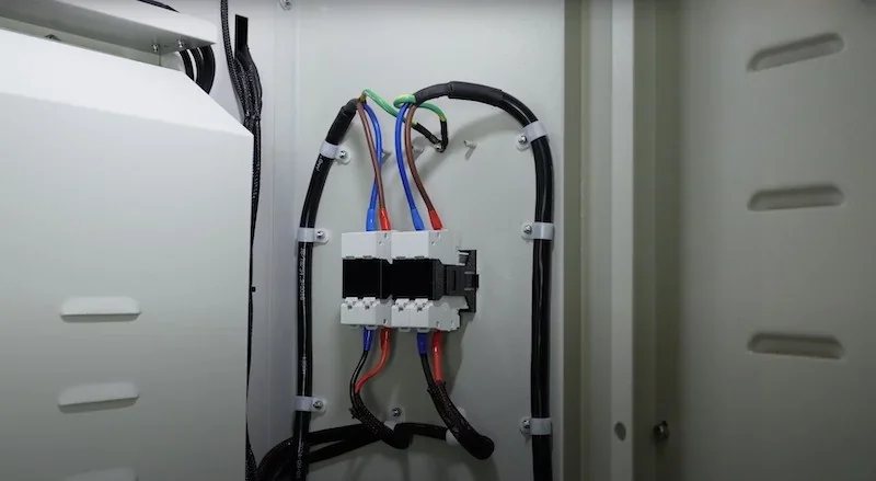 Wiring setup within creatbot d1000 pro hs 3D printer's panel, featuring organized cables and components, highlighting internal structure and design.