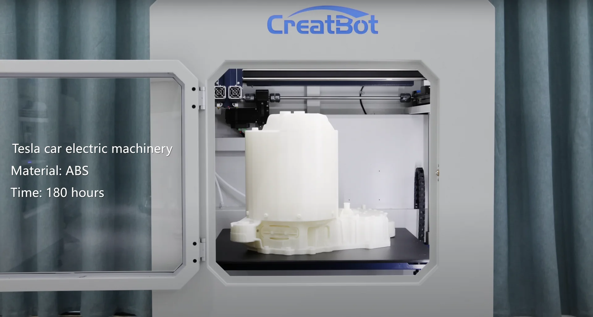 CreatBot D600 Pro printing Tesla car electric machinery part in ABS material, 180-hour process. White enclosure with CreatBot logo visible.