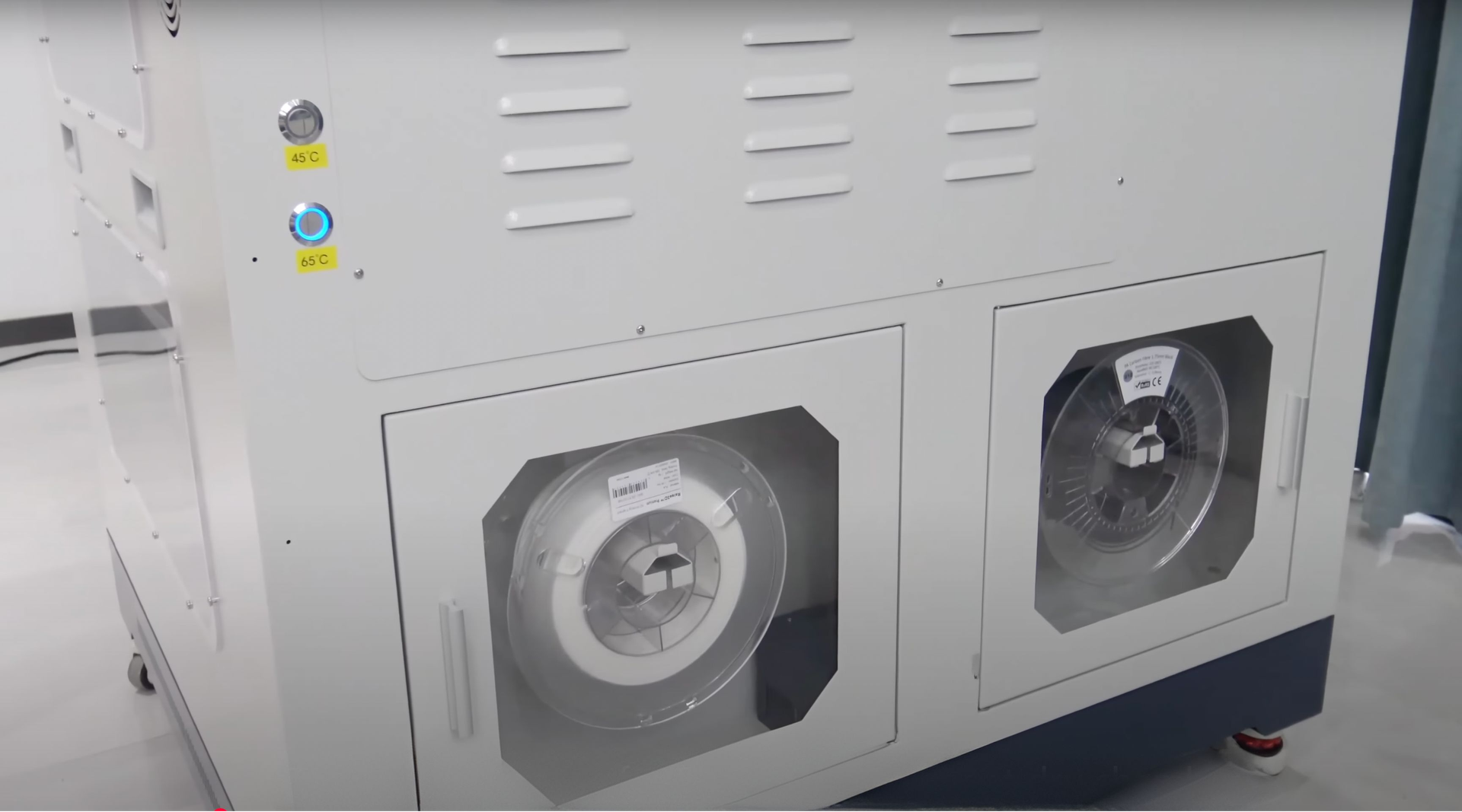 Creatbot D600 Pro with dual filament spools in a modern, white-gray setting, highlighting its advanced 3D printing capability and design.