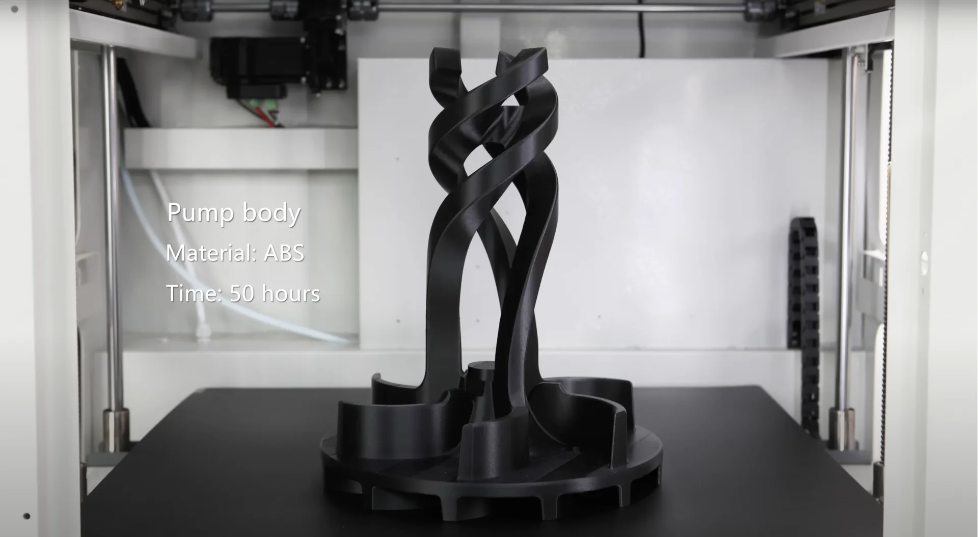 Creatbot D600 Pro 3D printer showcasing a black ABS pump body, featuring intertwined design, printed in 50 hours.