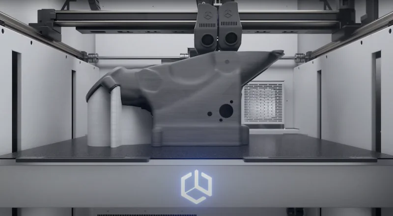 Creatbot D600 Pro2 HS 3D printer crafting a large, intricate part in a sleek, industrial setting, with visible branding on the machine.