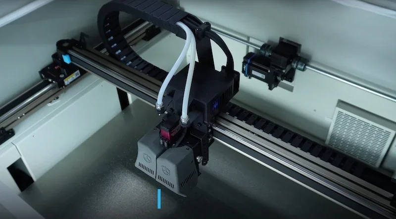 Creatbot D600 Pro2 HS 3D printer interior showing dual extruders on a gantry system, focusing on technical components and filament feed tubes.