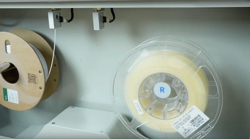 Creality D600 Pro2 HS 3D printer filament spools displayed inside the printer's chamber, showcasing dual spooling mechanism for precise printing.