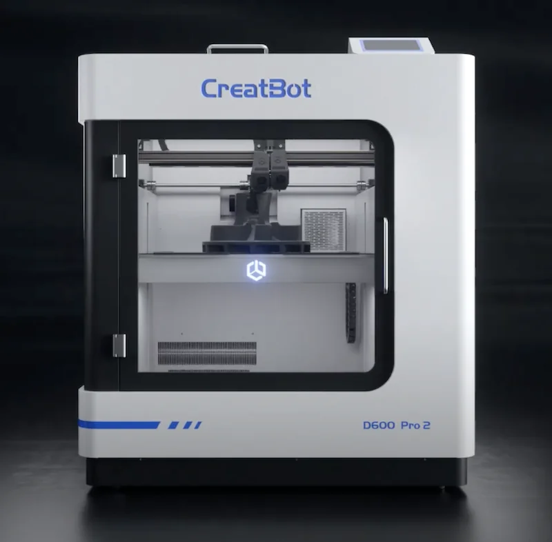 CreatBot D600 Pro 2 HS 3D printer in action; sleek design with lit interior showcasing printed samples.