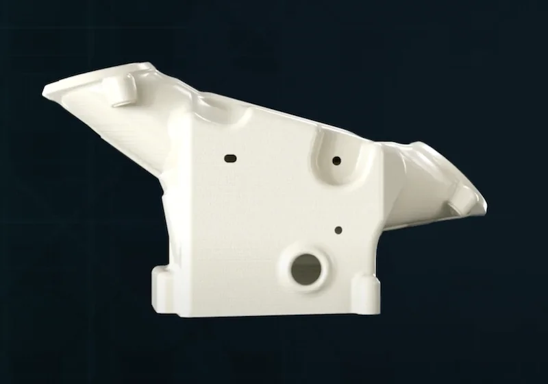 White 3D-printed mechanical part with complex geometry, created by the Creatbot D600 Pro2 HS, set against a dark background.