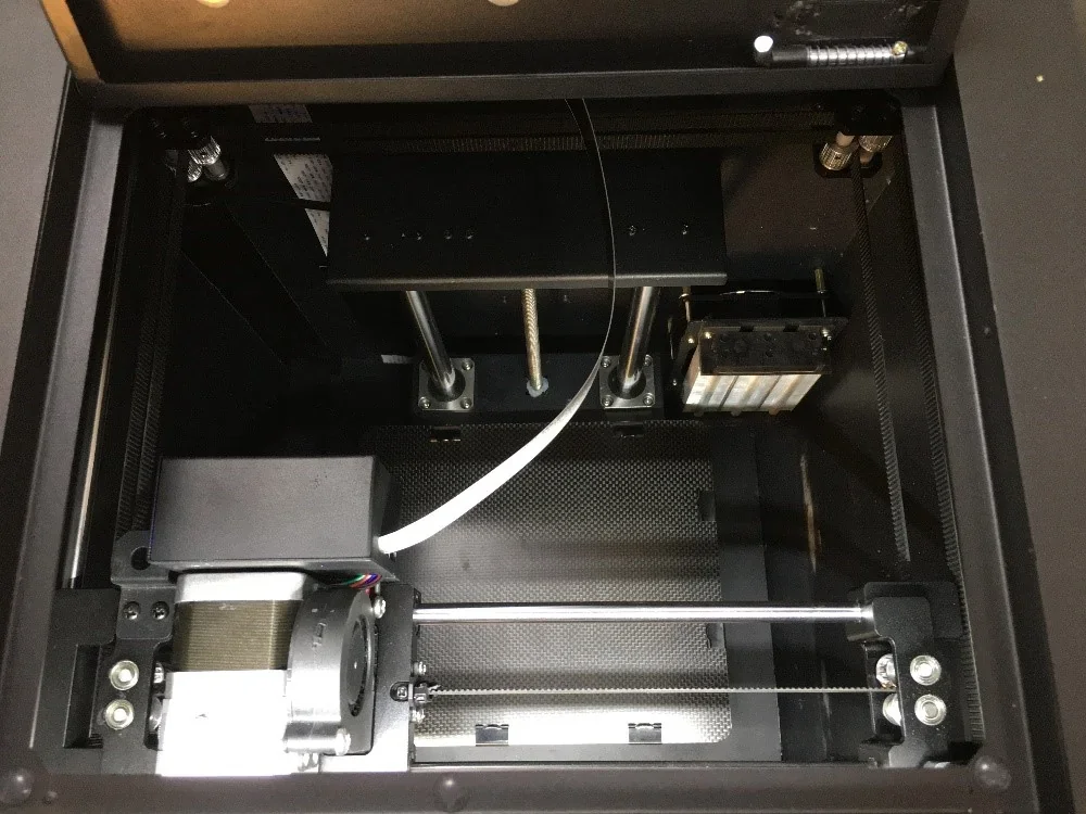 Creatbot F160 3D printer interior showing mechanical components and build plate, highlighting precision elements where samples were created.