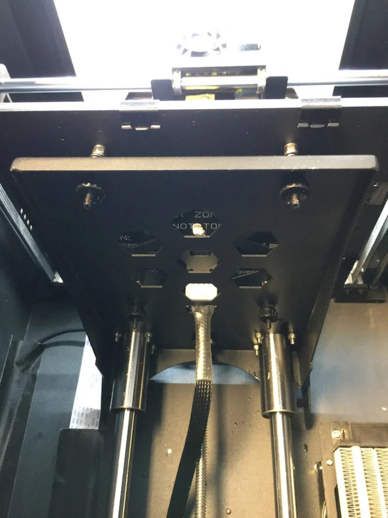 Creatbot F160 3D printer interior showing mechanical components, rods, and wiring.