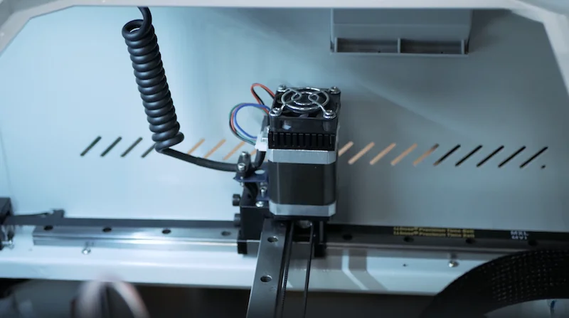 Creatbot F430 3D printer interior, showcasing the extruder and components, indicating precision and engineering excellence.