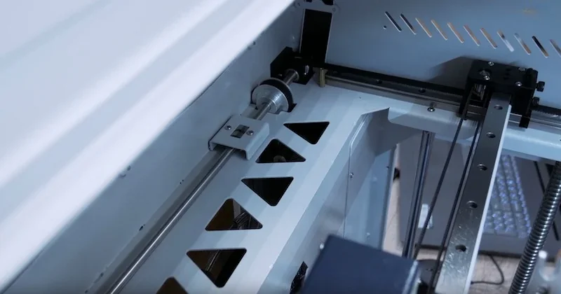 Creatbot F430 3D printer's internal mechanism showing intricate metal components and rails, highlighting its robust construction and technical precision.