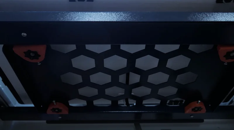 Creatbot F430 3D printer interior with hexagonal mesh structure, four red knobs, and metallic frame highlights industrial design.