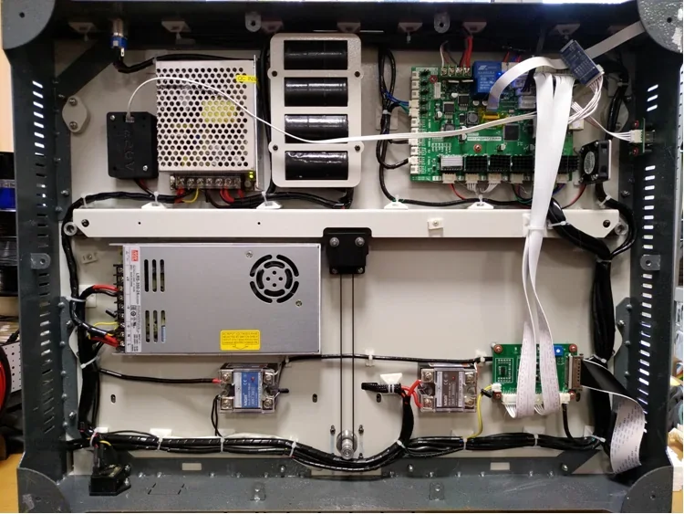 Creatbot F430 3D printer's internal electronics, showcasing power supply, wiring, and circuit boards, highlighting its technical components and build.