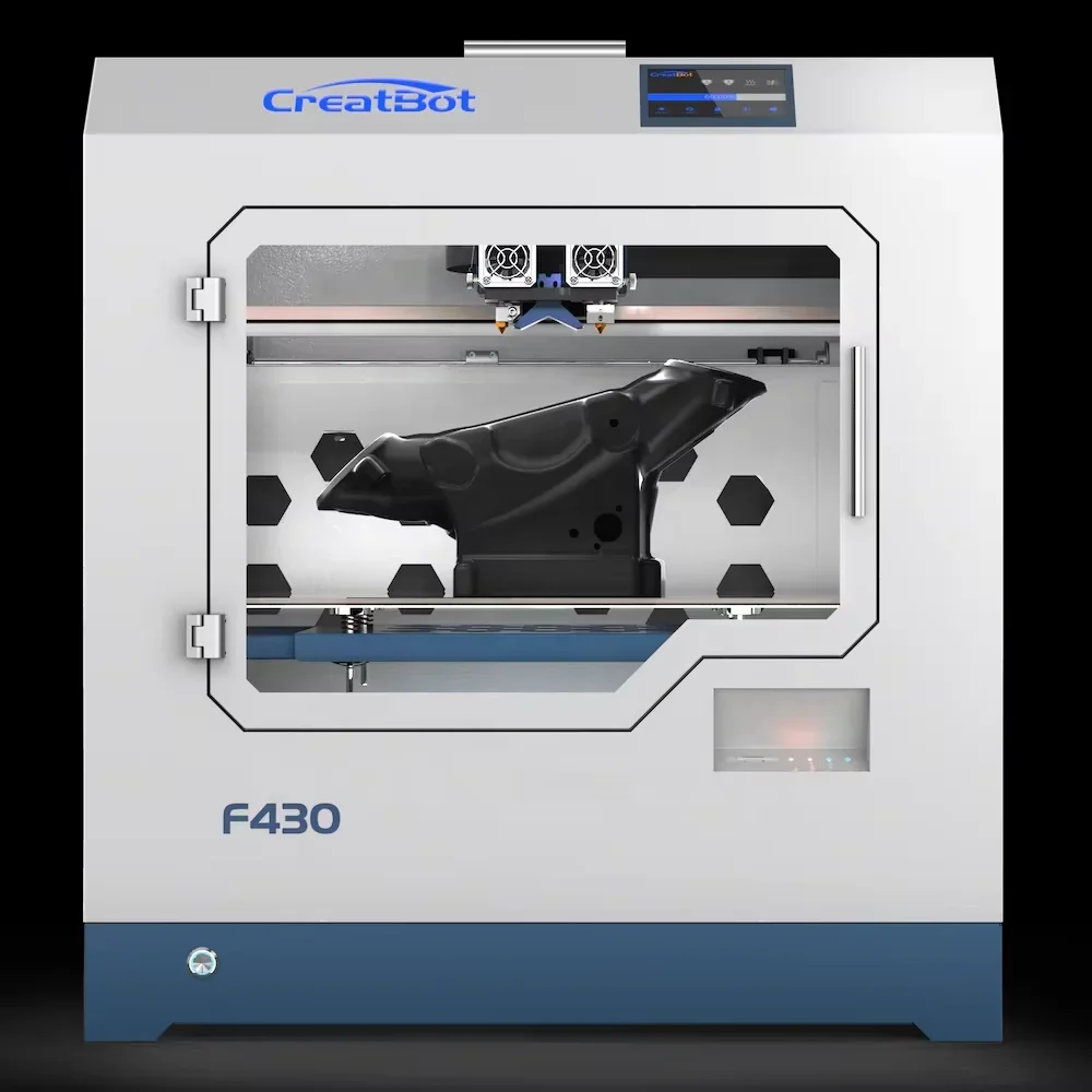 CreatBot F430 3D printer displaying a large black printed part inside its enclosed chamber with visible dual extruders and branding on top.