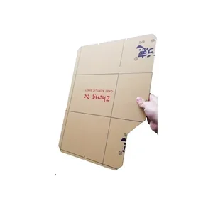 Cardboard piece held in hand with grid printed on one side, possibly used as a 3D printing template for the CreatBot F430 printer.