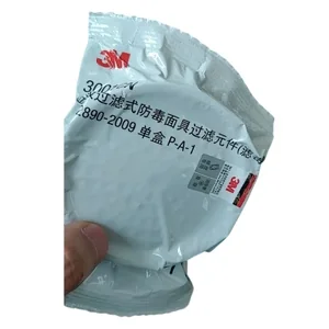 The image shows a 3M branded mask filter in sealed packaging, predominantly white with red logo and Chinese text.