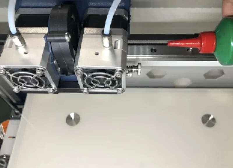 Dual extruder of CreatBot F430 3D printer in close-up, showcasing precision parts and nozzle detail for accurate printing.