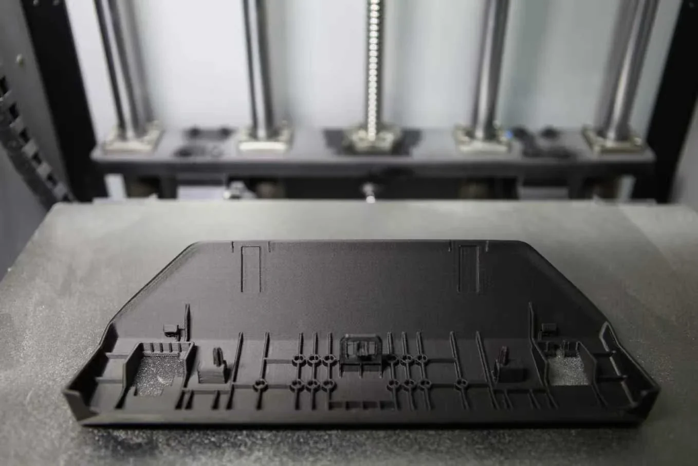 Creatbot F430 NX 3D printer with a detailed black printed part on the print bed, showcasing precision and build quality.
