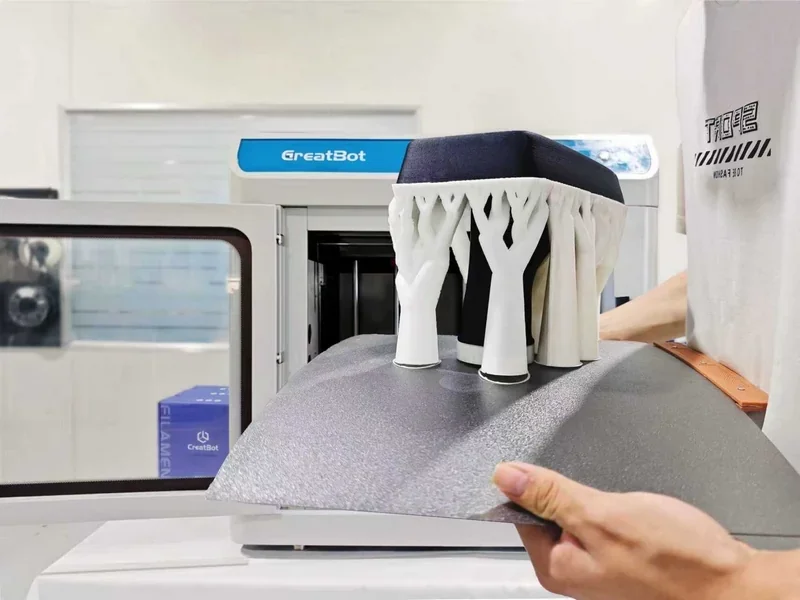 Creatbot F430 NX 3D printer with white geometric structure sample on bed; setting with visible Creatbot branding in background.