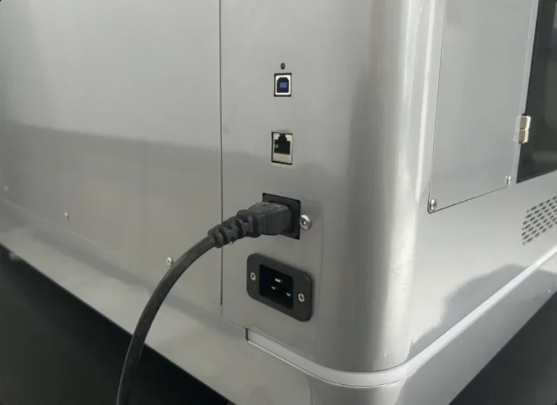 Creatbot F430 NX back panel showing USB, Ethernet ports, and power plug connection, highlighting connectivity features in a sleek design.