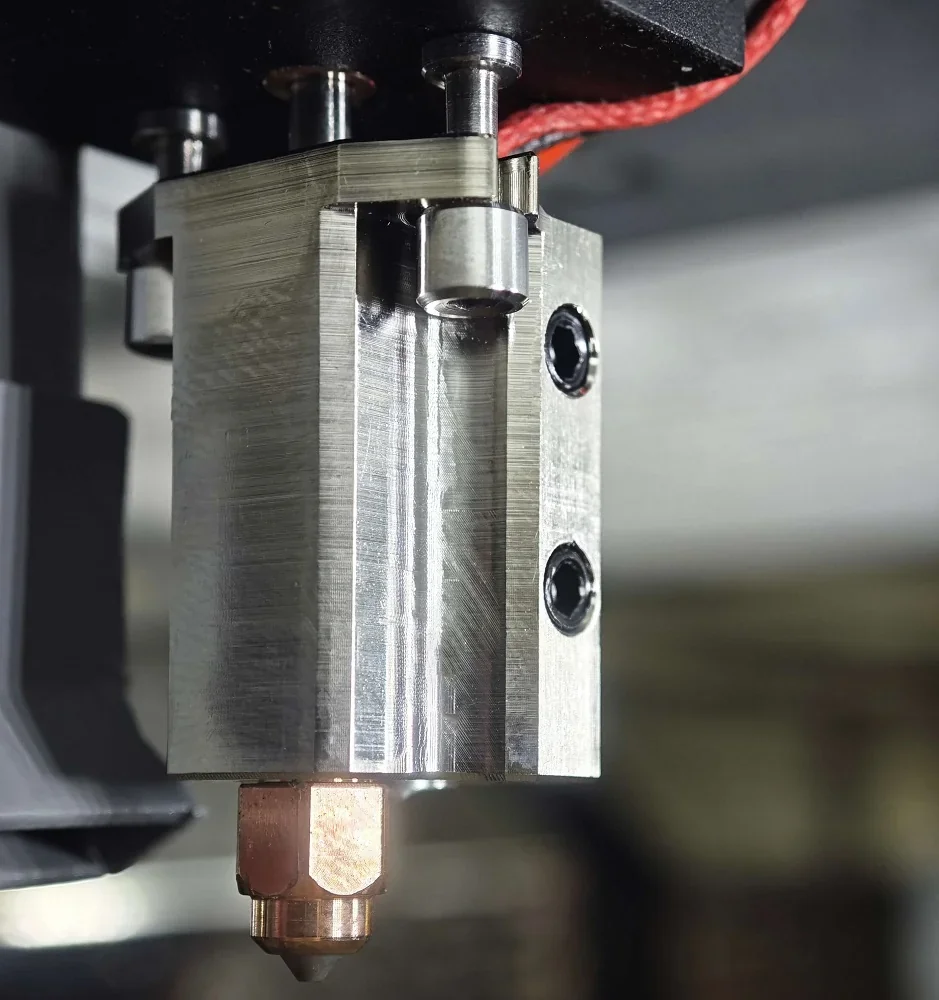 Metallic hotend assembly of Creatbot PEEK-250 3D printer, showcasing intricate design and precision engineering, crucial for high-temperature printing.