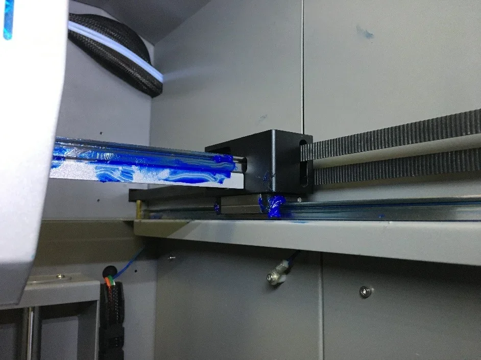 Creatbot PEEK-300 3D printer interior showing blue lubricant on rails and components, emphasizing machinery details and precision.