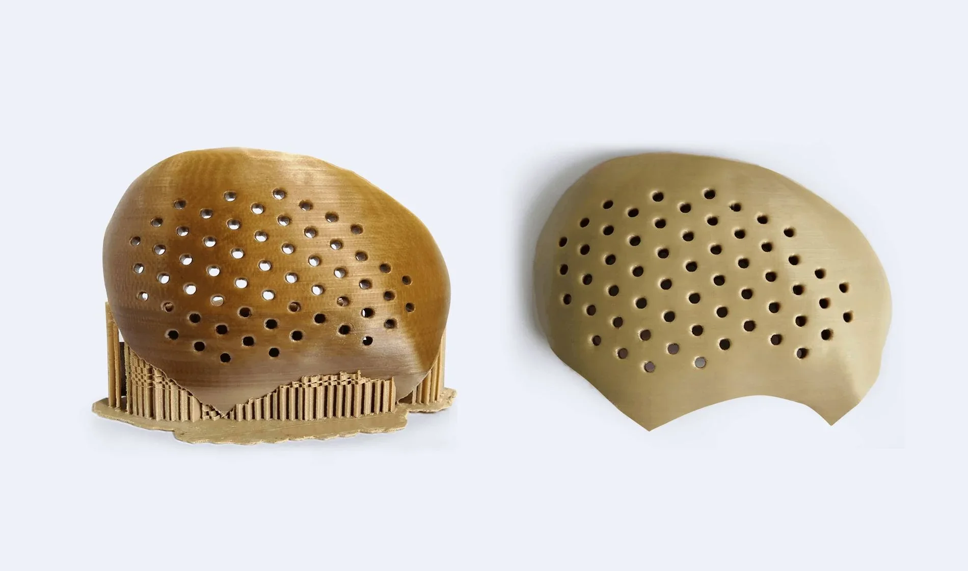 Two perforated, dome-shaped parts by creatbot peek-300; one with support material, showcasing 3D printing precision and design.
