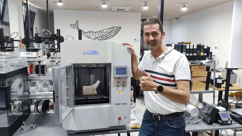 CreatBot PEEK-300 3D printer in a lab with filaments and parts, showing printed samples.