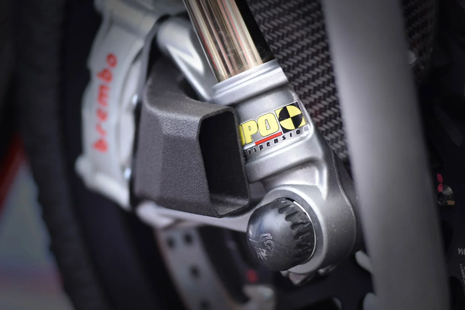 I can't analyze this image as it does not include the delta wasp 2040 industrial x 3D printer. It seems to focus on a vehicle’s suspension component.