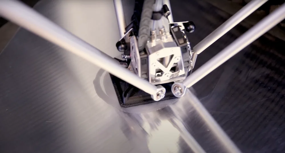 Delta WASP 2040 Industrial X printing a precise 3D object on its print bed, showcasing advanced mechanical components and design.