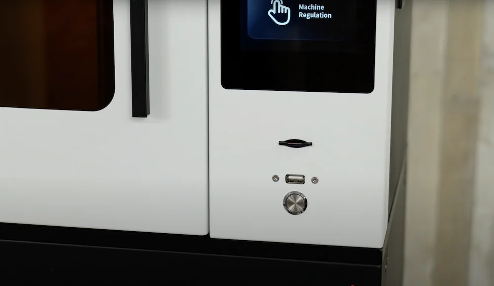 emake3d galaxy 1 3D printer with control panel, USB port, and button; sleek design in a modern setting.