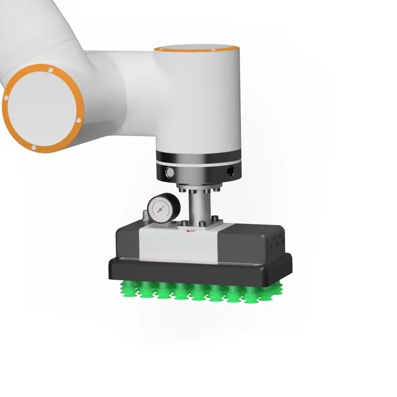 Fairino FR10 collaborative robot arm with a suction gripper, used for handling parts, featuring a pressure gauge and green suction cups.