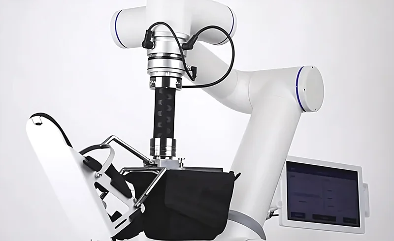 Robot arm fairino fr16 with a mechanical gripper, next to a control screen. The arm demonstrates its precision in a lab setting, emphasizing advanced robotics.