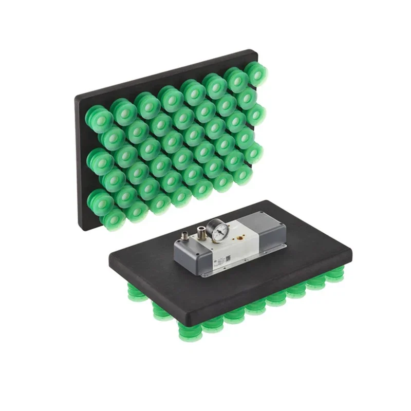 Green suction cup arrays on rectangular black bases, likely created by fairino fr30, with a metal gauge on one base.