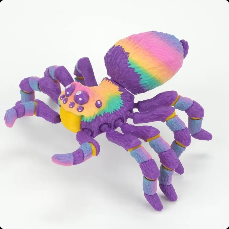 A colorful 3D-printed spider model showcasing vibrant hues of purple, yellow, green, blue, and pink against a white background. The spider features detailed textures on its body and legs, demonstrating precision and accuracy in its layered construction. This intricate model highlights the capabilities of the Flashforge Adventurer 5X 3D printer, known for its high-quality multicolor printing and intricate detail resolution. The robust and vivid colors suggest the use of advanced filament materials, showcasing the printer's ability to produce professional-grade, visually appealing outputs suitable for decorative or illustrative purposes.