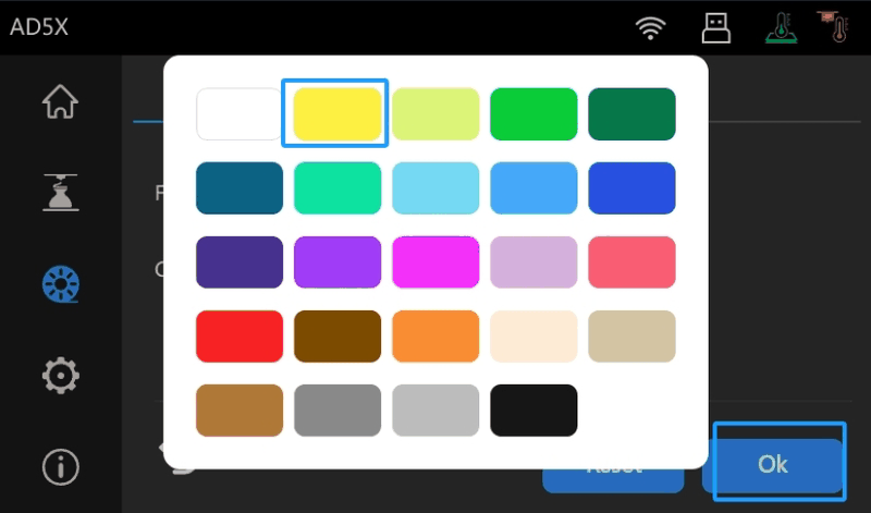 The display screen on the Flashforge AD5X 3D printer shows a color selection interface. The screen features a grid of 24 color options, outlined in white, with a bright yellow highlighted by a blue border indicating the current selection. The interface includes icons along the top, depicting home, Wi-Fi connectivity, USB port, and heating elements. On the left side, there are various symbols for 3D printing settings such as a gear for settings, a nozzle, and possibly filament or fan-related icons. A blue "Ok" button is visible at the bottom right, allowing users to confirm their selection. The background features a dark theme with subtle gradients, aligning with a modern tech interface.
