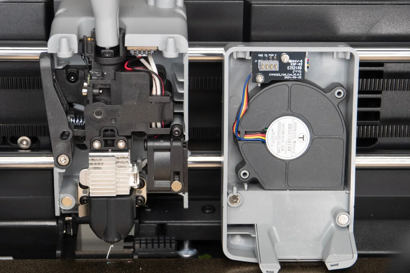 Flashforge AD5X printer parts, showcasing detailed view of print head assembly and cooling fan, with visible wiring and components.