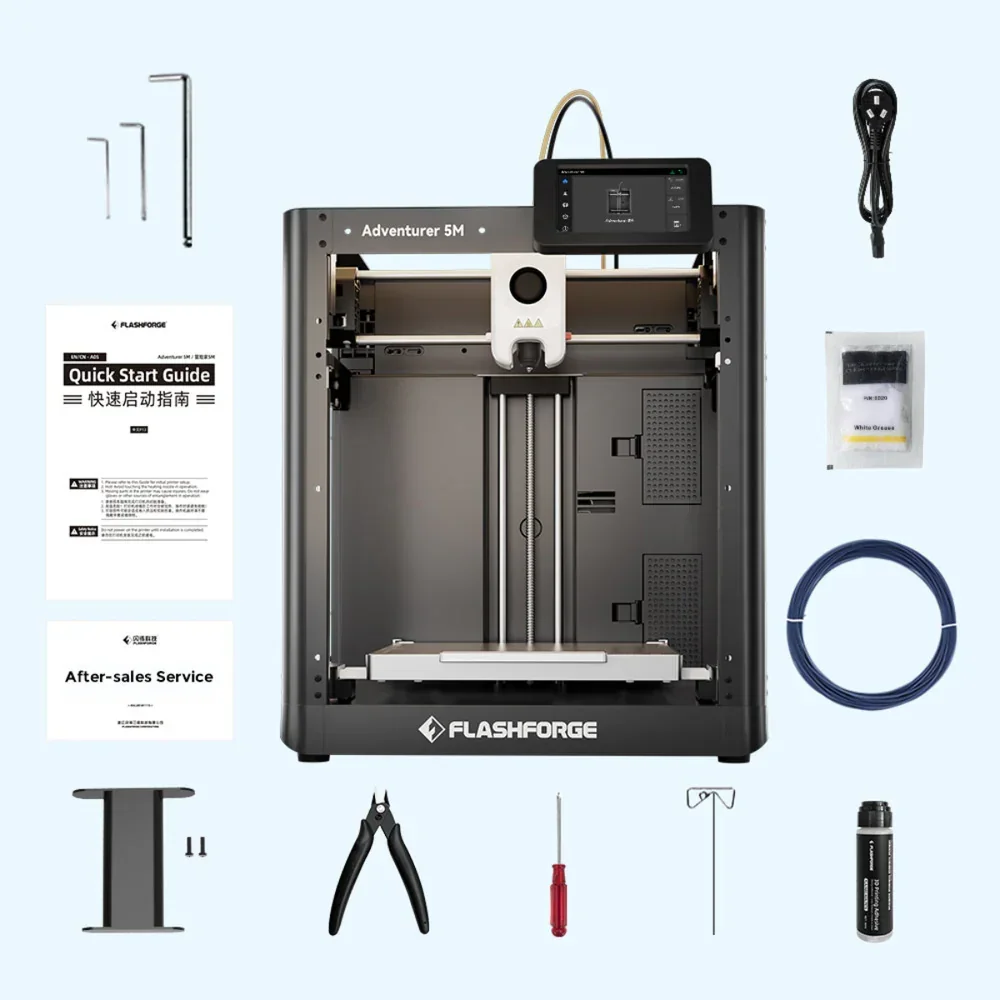 Flashforge Adventurer 5M 3D printer with accessories: tools, guide, cable, filament, grease, in a clean setup with branding visible.