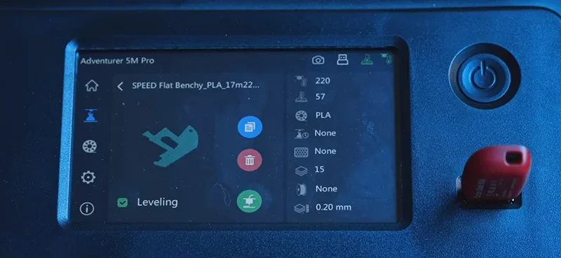 Flashforge Adventurer 5M Pro screen displays 3D printing settings with USB inserted, showing model rendering and leveling option.