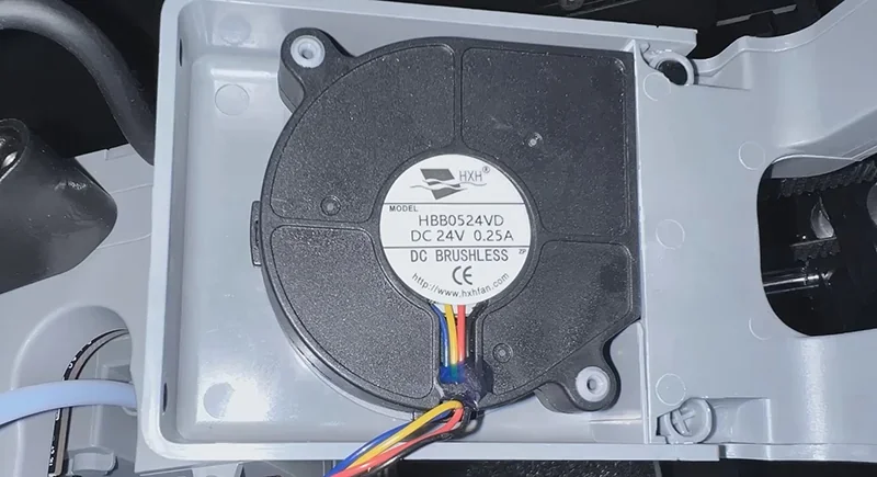 FlashForge Adventurer 5M Pro internal DC brushless fan, model HBB0524VD, with color-coded wiring, enhancing airflow and cooling efficiency.