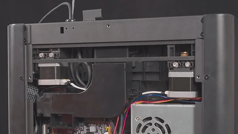 Flashforge Adventurer 5M Pro interior showcasing mechanical components, wires, and branding.