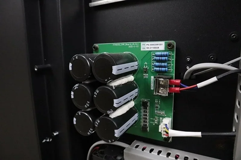 Flashforge Creator 4 circuit board with capacitors and wiring inside the printer, highlighting its internal electronic components.