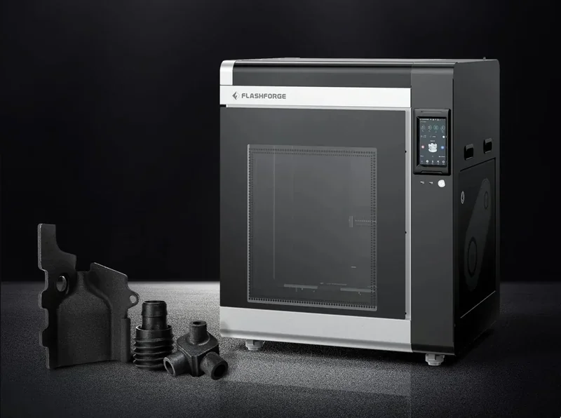 Flashforge Creator 4 in black, showcases a sleek design with a transparent door, alongside 3D printed black parts.