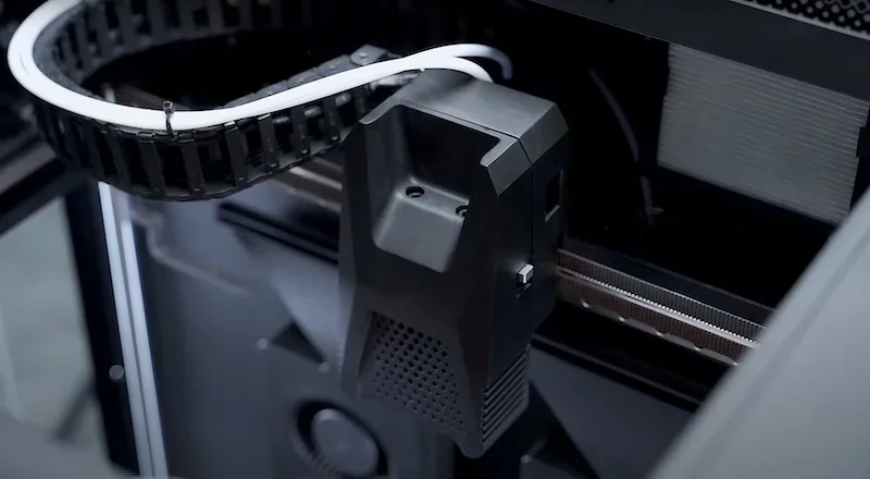 Flashforge Guider 3 Ultra 3D printer interior with filament guide and printer head, showcasing precision components created by the device.