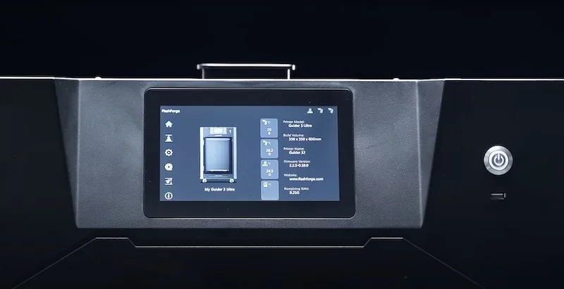 Flashforge Guider 3 Ultra 3D printer display shows interface with print details on a sleek black design, centered power button visible.