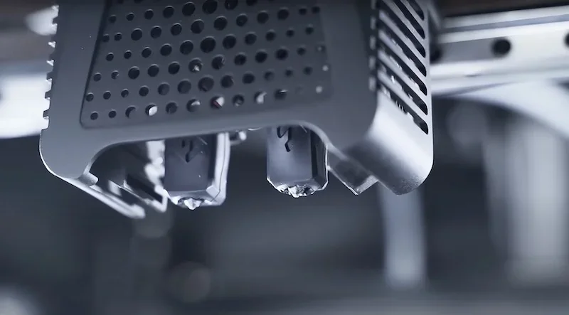 Flashforge Guider 3 Ultra 3D printer nozzle close-up, showcasing intricate design and precision parts produced by the printer.