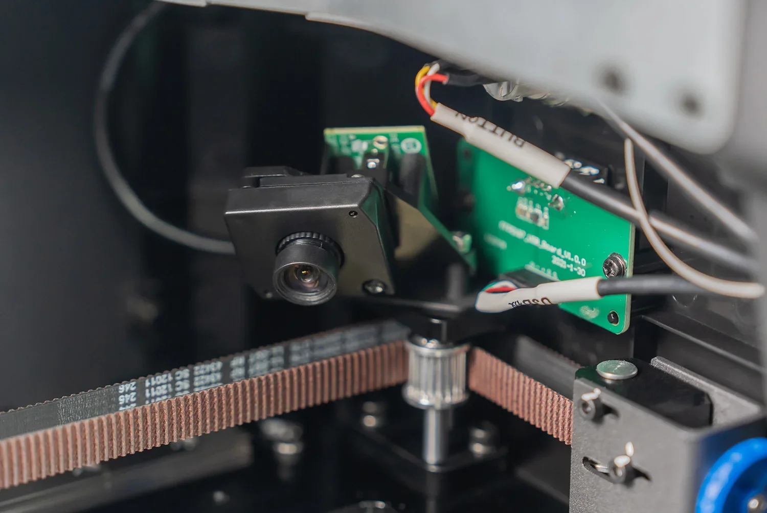 FlashForge Guider 3 Ultra 3D printer detail showing internal components, including circuit boards, cables, and mechanical parts, emphasizing precision engineering.