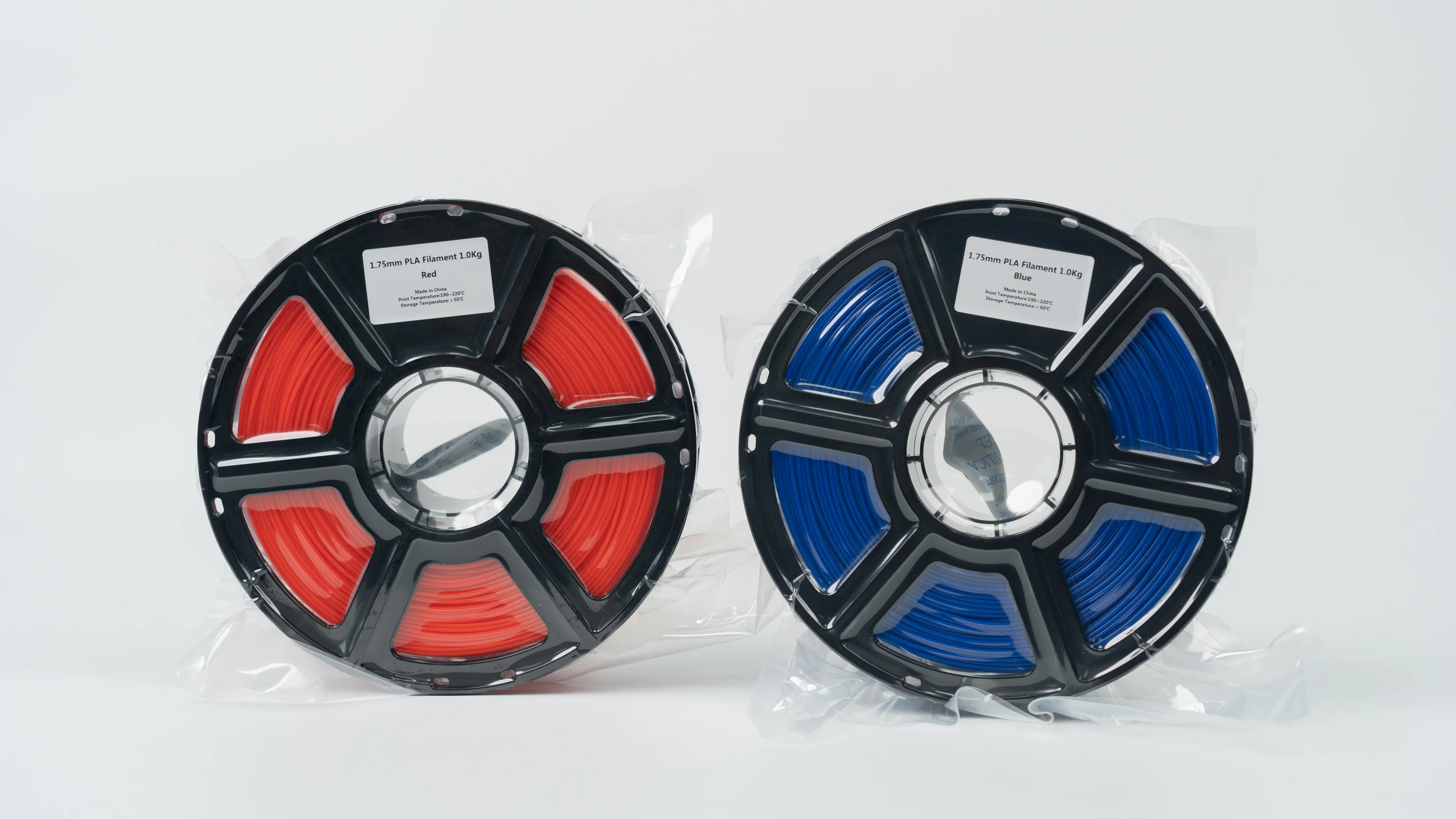 Red and blue PLA filament spools for FlashForge Guider 3 Ultra, labeled 1.75mm, 1kg each, in transparent packaging.