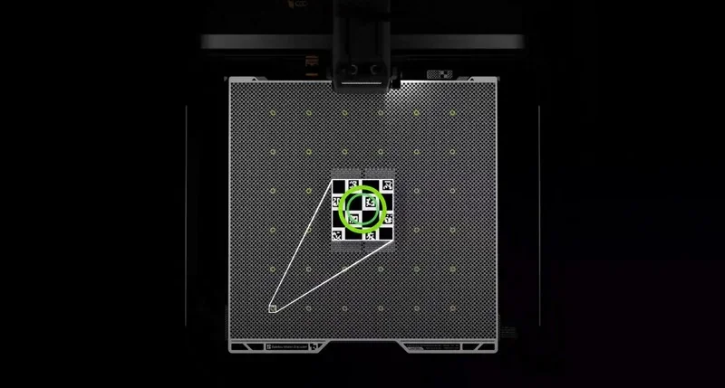 h2c bambu 3D printer heat bed with alignment markers and grid design, featuring a central calibration tool for precise printing.