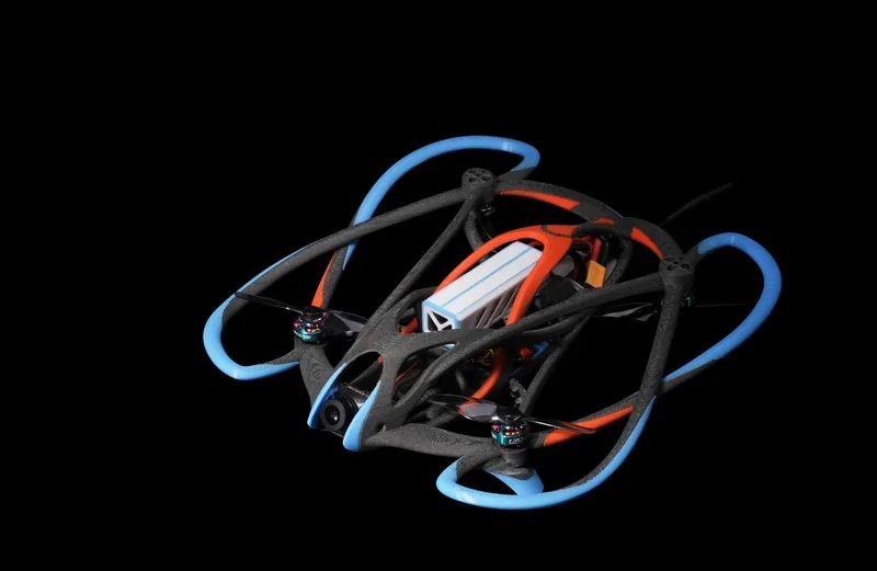Futuristic drone with blue and orange accents featuring an intricate frame, possibly 3D printed by h2c bambu, set against a black background.