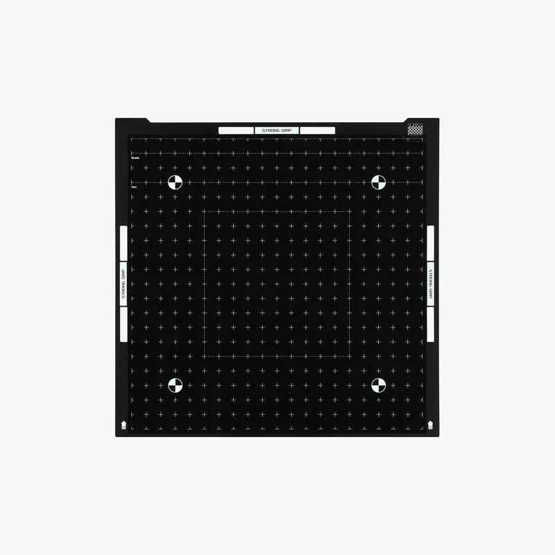 h2c Bambu print bed with grid and alignment markers showcased on a flat black surface for precision 3D printing.